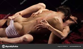 Sexy couple in bed. sensual couple in love. passion and desire. man and  woman play erotic games. having sex. sexual intercourse. lovers naked body.  orgasm. protect yourself — Stock Photo © stetsik 561665118