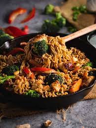 Skillet Filled With Ramen Noodle Chicken Stir Fry With Peanut Sauce Ramen Noodle Chicken Stir Fry Stir Fry Stir Fry Sauce Recipe