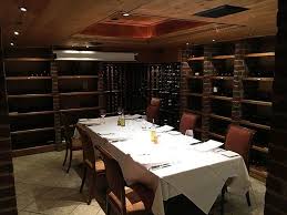 The cables are supported by the iron column & beam system. Old Church Turned Into A Wine Cellar With 10 Person Private Dining Room