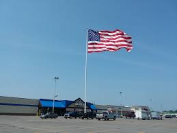 Big american flag with pole. Gander Outdoors Ordered To Remove Flag
