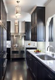 Stunning Kitchen With Glossy Black Kitchen Cabinets Marble Slab Counter Tops Back Splash Gray Walls P Eclectic Kitchen Black Kitchen Cabinets Kitchen Remodel