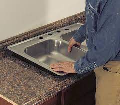Cut out your sink hole now.after cutting out the sink hole position the sink on the underside of the countertop in its desired position. Cut A Laminate Countertop For A Sink Fine Homebuilding