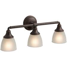 The frame has a burnished oil rubbed bronze finish. Kohler Devonshire 3 Light Oil Rubbed Bronze Wall Sconce Vanity Light K 10572 2bz The Home Depot
