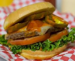 A giant sized, flame broiled beef pattie, topped with spicypepper jack cheese and jalapeno pepper rings on an oversized sesame seed bun. Menu Burgers Amore