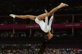 The university of florida first fielded a women's varsity gymnastics team in the fall of 1973. U S Gymnast Gabby Douglas Tumbles Over The Balance Beam During Women S Gymnastics Event Finals At The Gymnastics Events Amazing Gymnastics Olympic Gymnastics