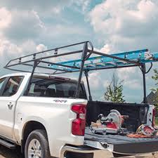 My original plan was to use those aluminum y shaped racks that slide into the stake holes on the top of bak makes a track rack type system but you need special bakflip rails for the rack too. Full Frame Steel Utility Ladder Rack By Tracrac A Division Of Thule Associated Accessories Chevrolet Accessories