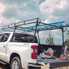 My original plan was to use those aluminum y shaped racks that slide into the stake holes on the top of bak makes a track rack type system but you need special bakflip rails for the rack too. Full Frame Steel Utility Ladder Rack By Tracrac A Division Of Thule Associated Accessories Chevrolet Accessories