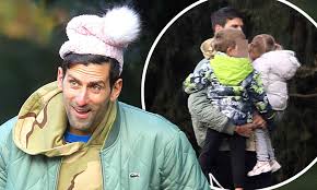 The professional tennis player and his family live in monte carlo, monaco. Novak Djokovic Puts On Playful Display As He Dons Daughter S Pink Bobble Hat During Family Outing Daily Mail Online