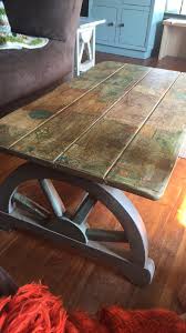 Learn how to make decoupage table with wrapping paper! Vintage Wagon Wheel Coffee Table Decoupaged With Maps Ginger S Attic
