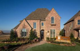 A Stately Exterior With Brick And Stone Charming Shutters And Pitched Roofing Prairie View Frisco Highland Homes Prairie View New Home Builders