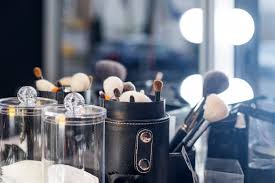 Premium Photo Professional Makeup Brushes On Make Up Table With Vanity Lighting