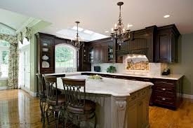 Elegant french country style kitchen cabinets of wood with a worn off white finish. Boston Metrowest French Traditional Kitchen With Mural Divine Design Center