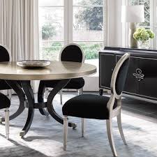 This oval dining table's design is typical of the french provincial actual and classical style. French Influence Modern Dining Suites With A European Flair