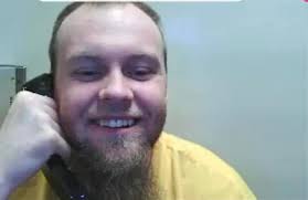 Department of Corrections... Corrections System... Do-Do? Video  Description: I am wearing a green, long-sleeve shirt and sitting in front  of a gray background. I have medium length brown, curly hair. Asking what