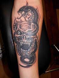 Skull Tattoos And Snake Tattoos Skull Tattoos Skeleton Tattoos