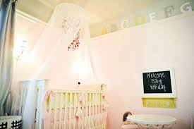 This crib has been styled for a shoot with pillows and toys. 15 Adorable Crib Canopy Designs For Eclectic Nurseries