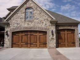 The minimalistic enlightenment and the stone pillars only add. Stylish Garage Doors Add Personality To Your New Home