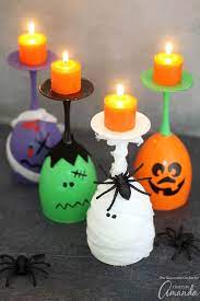 Once the tealight holder has cooled, use acrylic paints in pale browns or dark oranges to emphasise the lines on the pumpkin. Halloween Wine Glass Candles The Cutest Diy Halloween Decor