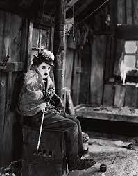 The gold rush is a 1925 american comedy film written, produced, and directed by charlie chaplin. Charlie Chaplin In The Gold Rush 1925 Photograph By Album