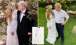 Boris johnson was facing an overwhelming clamour to sack matt hancock on friday night. Carrie Symonds Dons Boho Organza Tiered White Gown And Flower Crown For Wedding To Boris Johnson Daily Mail Online