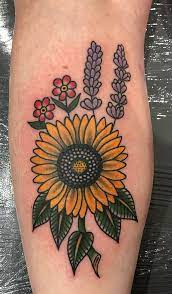 Tribal sunflower tattoo with a crescent for ladies. Traditional Sunflower Tattoos Meanings Tattoo Ideas More
