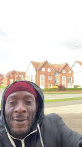 Outdoor Dance Performance in Black Jacket and Red Headwear