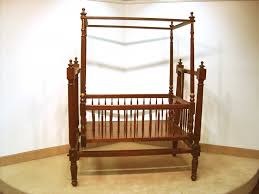 AN ANGLO-INDIAN REGENCY STYLE EXOTIC WOOD CRIB. | #1483563