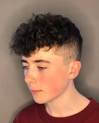 This buzzed hairstyle is for long hair and can be done so well if your boy has wavy or curly hair. 17 Curly Hair Fade Haircuts For Sexy Guys In 2021