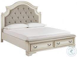 Beautifully crafted from acacia, the suite exhibits subtle wood grain for a natural finish, while a mineral grey stain provides a sophisticated, modern look. Realyn Chipped White King Upholstered Panel Bed With Bench Footboard From Ashley Coleman Furniture