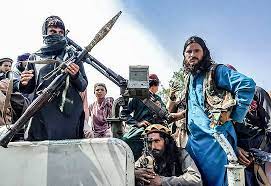 Taliban fighters stand guard in kunduz after capturing the strategic city in northern afghanistan on sunday. Wxsfbbdhncbr8m