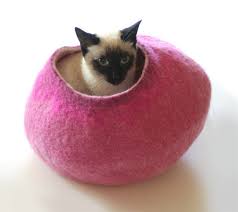 It is a beautiful beige color with a cute paw print design around the opening. Cocoon Cat Beds Cat Beds