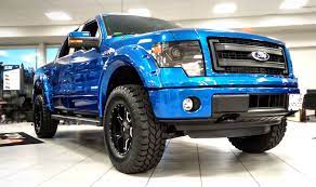 Sold This Stylish And Modified Kentwood Kustoms 2014 Ford F 150 Fx4 In Blue Flame Metallic Has 13 Km On Its Odometer Black Inte Ford F150 New Trucks Ford