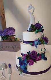 You may find the daisy a fitting flower for your wedding if you plucked its white petals in a game of he inspiration: Layered Wedding Cake With Blue And Purple Flowers Wedding Cakes Minneapolis Bakery Farmington Bakery