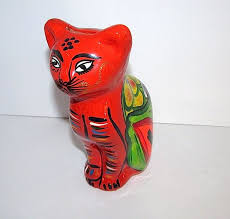 Maybe you would like to learn more about one of these? Vintage Mexican Folk Art Pottery Cat Piggy Bank Figurine
