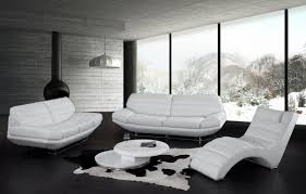 An elegant living room dominated by black and white where the white sofa set is paired with black throw pillows and the black wooden center table. Modern White Living Room Furniture Sets Storiestrending Com
