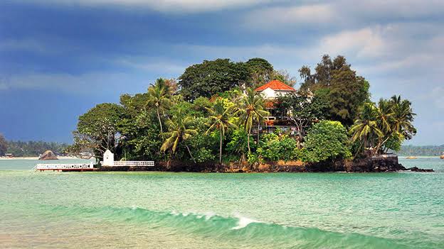 Taprobane Island colonial villa French count Paul Bowles coconut palms offshore Weligama Bay wade low tide Sri Lanka