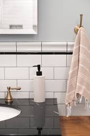 The large wall marble tile and curved marble floor tile open up the space and give it a luxurious background, which perfectly matches the gold and mirrored furniture and accessories. Vanity Backsplash Nbizococho