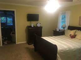 This bedroom space is all about texture! How To Brighten And Open Dark Room With Dark Furniture