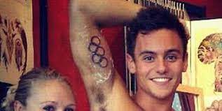 Tom daley and his husband dustin lance cooing over their young baby. Tom Daley Gets A Tattoo