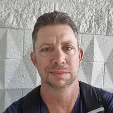 What team is in the photo with Tom Bunt?