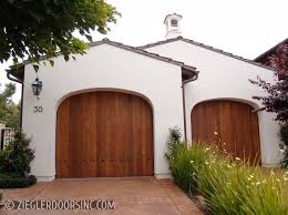 Choosing the right garage door can make a huge difference to the over all appearance of your home. Spanish Old World Wood Garage Doors Zielger Doors Inc