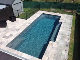 A Compass Pools 9 4 Vogue In Viridian From The Bi Luminite Range Of Colours Pool Colors Pool Paving Travertine Pool
