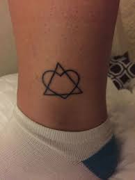 For carlos he is going to get stitch dressed as elvis and hopefully holding a baby bottle with coffee, or the ace of hearts, since that is carlos' initials, that is if we can ever find a good example. Adoption Heart Tattoo The Y Guide