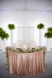 Our Sweetheart Table Rose Gold Glitter Table Cloth With Baby S Breath And Tiny Pink Roses We Rose Gold Wedding Decor Rose Gold Wedding Table Rose Gold Table
