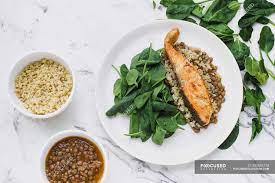Some freshly transfer cooled lentils into a bowl and mash properly. Served Plate With Salmon Steak Couscous Lentils And Greenery On Table With Bowls Of Lentils And Couscous Meal Organic Stock Photo 295692778