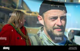 Angie Blannin mother of sniper Jac Holmes as the coffins of British men Jac  Holmes and Ollie Hall who were killed while fighting Islamic State in Syria  leave Heathrow Airport after arriving