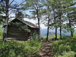 Cabin rental includes sheets, towels, kitchen utensils, and firewood. Blue Suck Falls Hike