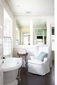 A modern country bathroom with white planked walls, a hexagon tile floor, wooden vanities, a modern tub and black fixtures. 20 Best Farmhouse Bathroom Design Ideas Farmhouse Bathroom Decor