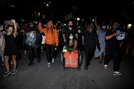 Whitney mitchell, center, fiancee of garrett foster, and chase mayo, left, with his wife, anna mayo, who is the sister of foster, join with hundreds of people for a vigil in memory of foster. Who Was Garrett Foster The Blm Protester Who Was Shot In Front Of His Fiancee At An Austin Protest