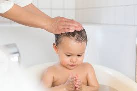 Why do you need a baby neck float? Baby Girl Playing In A Tub Stockphoto